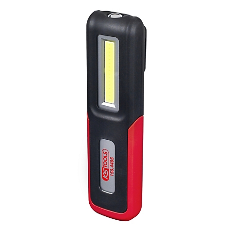 Zwarte, rode en zilveren werklamp van KS TOOLS. De lamp heeft een rechthoekig ontwerp met een wit lichtveld en een metalen clip.
